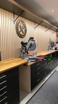 a workbench with many drawers and tools on it