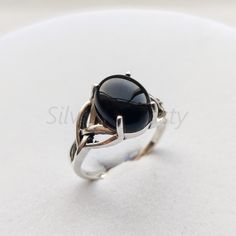 Stone : Natural Black onyx Metal : 925 Sterling Silver Stone Size : 9x11mm Shape : Oval Ships worldwide from India 925 stamped Handmade Item ABOUT Natural Black onyx Onyx gives strength.  It promotes vigour, steadfastness and stamina.  Imparts self-confidence, helping you to be at ease in your surroundings.  Onyx banishes grief, enhances self-control and stimulates the power of wise decision-making.  It encourages happiness and good fortune. STYLE STATEMENT This ring would be perfect to match up Silver Onyx Cabochon Rings, Black Sterling Silver Promise Ring, Black Sapphire Ring In Sterling Silver, Black Opal Gemstone Ring, Black Opal Cabochon Ring As Gift, Black Opal Ring With Cabochon As A Gift, Elegant Black Opal Ring Gift, Elegant Black Opal Ring As Gift, Elegant Black Opal Ring For Gift