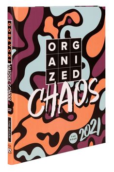 an orange, purple and black book with the words organized chaos written on it