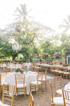 the tables are set up for an outdoor wedding