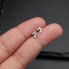 Real 925 Sterling Silver Tiny Leaf Vine Stud Earrings These lovely earrings can be used in Earlobe, Tragus and Cartilage. Measures 8.5 x 5 mm Comes with pushback backings Sold by Pair Jewelry will come in a gift box * Please read shop policy before placing an order * *JEWELRY CARE* Sterling Silver will tarnish over time, but to help keep your jewelry looking beautiful - Clean with a soft dry cloth after wear and store inside an airtight bag or container. Remember to remove your jewelry when: * A Simple Silver Stud Earrings, Applying Perfume, Leaf Earrings Silver, Paired Jewelry, Feminine Jewelry, Jewelry Nature, Silver Leaves, Nature Earrings, Minimal Jewelry