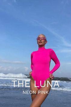 The Luna is such a versatile piece of swimwear and is a great addition to your beach day wardrobe. The one piece surfsuit is made from sustainable material and as an outfit it looks great on any ocassion, whether you have a beach day, pool party or want to rock your surf girl style. You can shop our best selling swimsuit here: Spring Long Sleeve Surfing Bodysuit, High Stretch High Neck Swimwear For Summer, Chic High Stretch Bodysuit For The Beach, Spring High Neck Bodysuit With Thumbholes, One-piece Bodysuit For Spring Surfing, Trendy Fitted Bodysuit For Beach, Chic High Stretch Swimwear For Spring, Summer Bodysuit With Thumbholes, High Stretch Bodysuit For Swimming In Spring