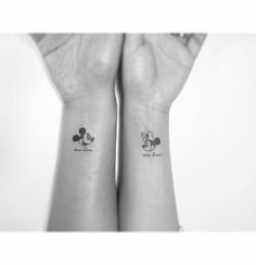 two wrist tattoos with mickey and minnie mouse on them