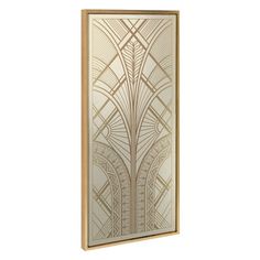 an art deco wall hanging on the side of a white wall with gold trimmings