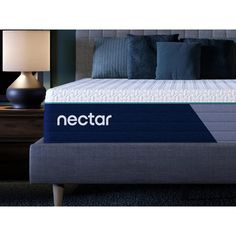 the nectar mattress topper is shown in front of a night stand