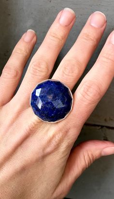 This stunning cube cut semi precious bright cobalt blue lapis lazuli cabochon is set in a fine silver bezel and sterling silver platform. The ring band is handmade from half dome sterling silver wire. The stone itself has many different dimensions and with natural flecks or veins of pyrite throughout the lapis adding an edge to this ring. The cabochon is 30mm in size or about 1 1/4 inched size circle in size. It is not a heavy ring despite its size and is comfortable to wear. The stone has been Sapphire Silver Ring, Silver Platforms, Blue Lapis Lazuli, Statement Ring Silver, Blue Lapis, Agate Ring, Geometric Jewelry, Silver Pearls, Fine Silver