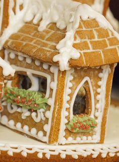 a gingerbread house decorated with icing and decorations