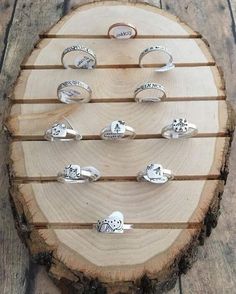 several rings are arranged on a piece of wood