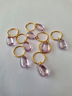 Set of 8 lavender teardrop shaped glass charms on brass hair rings.  Rings fit all braids and locs. Braid Hair Charms, Gold Hair Charms, Hair Rings Crystals, Charm Hair Ring, Box Braid Jewelry Hair Accessories, Braids And Locs, Braid Rings, Braid Jewelry, Loc Jewelry