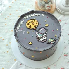 a birthday cake with an astronaut on it