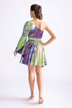 Green and purple short dress with daisy orchid print. - Aza Fashions Purple Dress With Asymmetrical Neckline For Spring, One Shoulder Floral Print Cocktail Dress, Chic One Shoulder Floral Print Cocktail Dress, Elegant Multicolor Dress With Asymmetrical Neckline, Spring Purple Dress With Asymmetrical Neckline, Multicolor Dresses With Asymmetrical Neckline, Floral Print One Shoulder Evening Dress, Purple One Shoulder Dress For Spring, Spring Floral Print One Shoulder Cocktail Dress