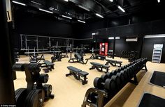 an empty gym with rows of weight machines