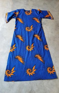 "Striking vibrant royal blue vintage African print caftan muumuu dress with embroidered detail and angel sleeve Great print and colors - lovely embroidery and nice long maxi length no tags - fabric is marked \"wax block prints hi target \" circa 90s I believe but as it doesn't have tags I'm not 100% sure size/fit estimated fit: l could fit various sizes depending on preference, body type etc. approx meas armpit 22\" shoulder 16\" hip 26\" length 57.5\" shown unpinned on 5'8\" size s 32d-25-35 co Blue Cotton Kaftan With Batik Print, Blue Cotton Floor-length Maxi Dress, Blue Cotton Maxi Dress Floor-length, Traditional Blue Dress With Kimono Sleeves, Blue Fitted Dresses With Kimono Sleeves, Blue Fitted Dress With Kimono Sleeves, Blue Short Sleeve Maxi Dress For Festival, Blue Cotton Maxi Dress With Batik Print, Traditional Long Blue Maxi Dress