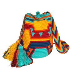 Colorful & unique crochet bag! Very lightweight, durable and comfortable to carry on. Wear it as a cross-body or shoulder bag. This stunning boho style bag is perfect for a casual day, as a beach/pool accessory or as a complement to your sports outfit. Details: Medium Size Bucket Bag Style Desert Sunset Colors (Yellow, Orange, Navy, Burgundy) Traditional indigenous symbology pattern. Matching hand-woven strap with zig-zag pattern Drawstring closure with tassels Material: Made from cotton threads Fall Color Combinations, Bucket Bag Style, Cutest Crochet, Boho Style Bag, Crochet Boho Bag, Sports Outfit, Mini Mochila, Boho Chic Style, Purses For Women