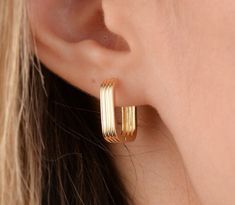 Our square hoop earring is 14k solid gold. It will accompany you every day and everywhere with minimalist style. The closure of our gold hoop earring is very comfortable and it does not disturb you at all. If you think of it as a gift, it will be a perfect gift for your loved ones on mother's day, birthdays, valentine's day, anniversaries, or graduations. 🎁 If you want you can add a gift note for your loved ones. It arrives in a special jewelry gift box. ✨ We respond to your questions happily. Chunky Minimalist Earrings, Rectangular Yellow Gold Huggie Earrings Gift, Modern Hoop Earrings For Gift, Rectangular 14k Gold Huggie Earrings As Gift, Modern 14k Gold Hoop Earrings As Gift, Modern Hoop Earrings As Gift, Modern Yellow Gold Hoop Earrings Gift, Modern 14k Gold Huggie Earrings Gift, Thick Gold Hoops