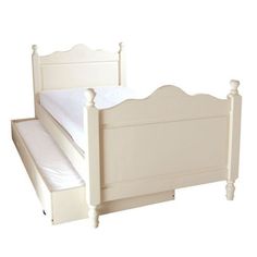 a white bed frame with hearts on the headboard and foot board, against a white background