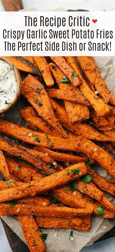 the recipe for crispy garlic sweet potato fries is shown on a plate with dipping sauce