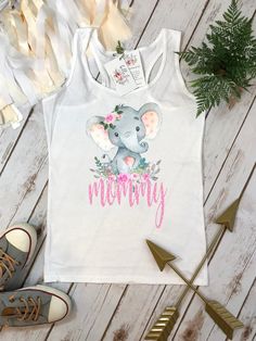 "Such a cute Mommy shirt to match your little one on her birthday! This custom design features a watercolor style elephant with floral elements and the word \"mommy\" in pink polka dot letters. Have yourself stand out with this custom design which you'll be able to wear long after her birthday! Also makes a great gift! Matching Girls Design here: https://www.etsy.com/listing/782009801 ----> PLEASE READ ALL INFORMATION BELOW BEFORE ORDERING <---- IMPORTANT INFO BELOW This listing is for the Pink Top With Funny Print For First Birthday, Customizable Cute Tops For Mother's Day, Cute Tops With Funny Print For First Birthday, Playful Personalized White Tops, Personalized Pink Top For First Birthday, Personalized Pink Tops For First Birthday, Cute Top With Name Print For First Birthday, Cute Tops With Name Print For First Birthday, Custom Pink Tops For First Birthday