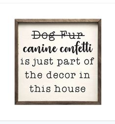 a framed sign with the words dog fun, canine canfitti is just part of the decor in this house