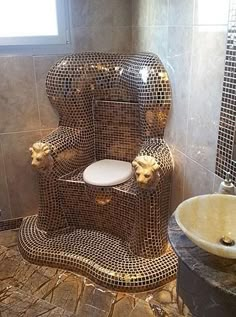 a toilet made out of shiny tiles in a bathroom