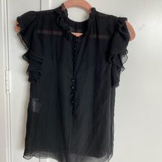 Balenciaga Blouse Black Silk Tops For Daywear, Black Sleeveless Blouse For Daywear, Black Silk Summer Blouse, Black Silk Short Sleeve Blouse, Black Silk Blouse For Summer, Black Silk Top With Ruffles, Black Silk Ruffled Top, Black Ruffled Blouse For Daywear, Black Silk Blouse For Office