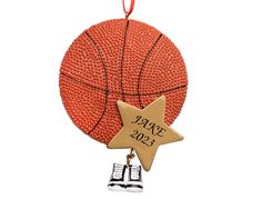 a basketball ornament with a star hanging from it's side on a white background