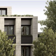 an apartment building with balconies and plants growing on the balconyes, in front of some trees