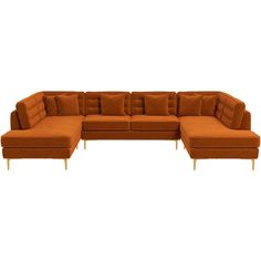 an orange sectional sofa with several pillows on the top and bottom, sitting in front of a white background