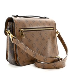 This is an authentic LOUIS VUITTON Reverse Monogram Pochette Metis. This chic handbag is finely crafted of Louis Vuitton monogram toile canvas. The bag features a lighter brown canvas flap and back, a black leather strap handle, an optional adjustable light brown monogram canvas shoulder strap, a rear exterior zipper pocket, and a V-shaped front flap with a brass S-lock. The flap opens to a partitioned black microfiber interior. Louis Vuitton Monogram Bag, Louis Vuitton Crossbody Bag, Black Leather Top, Louis Vuitton Crossbody, Louis Vuitton Empreinte, Louis Vuitton Vernis, Louis Vuitton Pochette, Handbag Outlet, Monogram Bag