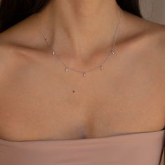 Need an elegant and sophisticated jewelry piece to elevate your ensemble? Our marquise diamond necklace takes your look to the next level with its dainty chain and delicate teardrop diamond charms. Material: High Quality Solid 925 Sterling Silver Finish: Sterling Silver ∙ 18K Gold Featuring five 2mm x 5mm Marquise CZ Diamonds spaced ~3cm apart, on an adjustable 16 to 18 inch chain. Model is wearing the 17 inch length SKU: RR-NR091 Marquise Diamond Necklace, Caitlyn Minimalist, Teardrop Diamond, Sophisticated Jewelry, Dainty Chain, Diamond Charm, Station Necklace, Marquise Diamond, Crystal Charm