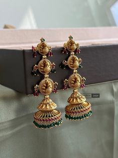 Three layer Peacock Hanging Drop Temple jhumka earrings.High premium quality and kemp stone used . Light weight . Shipping is 2-3 days and delivery is 4-5 days . brass material is used . Brass Chandbali Jhumkas For Rituals, Brass Temple Jewelry Jhumkas For Rituals, Bollywood Jhumkas With Peacock Design For Rituals, Chandbali Peacock Earrings For Puja, Peacock Design Chandbali Earrings For Puja, Peacock Design Jhumkas For Navratri Puja, Festive Peacock Design Jhumkas For Rituals, Temple Jewelry Jhumkas With Tilla, Navratri Peacock Design Jhumkas For Puja