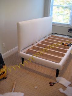 the bed frame is made up and ready to be used as a headboard or foot board