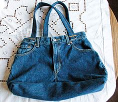 a blue purse sitting on top of a table