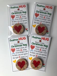 three christmas hug magnets are shown in front of a card that says, there's a little help for the heart