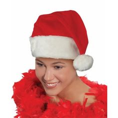 a woman wearing a santa hat and red feathers