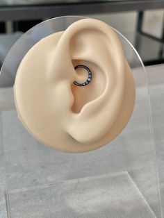 a fake ear with a ring on top of it