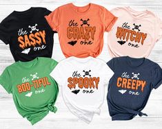 Custom Halloween Matching Shirts, The Spooky One Tee, Funny Halloween Group Tees, The Creepy One T-Shirt, The Sassy One, Halloween Saying Welcome to VickyTeeDesign Shop! How to Order  * Please choose your t-shirt color and the shirt size by the drop-down menus * Enter the design idea or the personalization if you would like. * Please feel free to ask any questions. My Shirt Material Is Below:   Solid colors: %100 Cotton. (White and Black) Heather colors: %52 Cotton + %48 Polyester. Please Consider the Care Instructions Below:  * Cold Wash * Turn inside out * Do Not use bleach * Wash with like colors * Tumble Dry Low or Hang Dry * Medium Iron * Do not iron the decoration * Do not dry clean. Please contact me if you have any problems with your product. Thanks for your shopping. The Spooky One, Spooky One, Halloween Group, Halloween Matching, Friend Vacation, Group Costumes, Group Shirts, Halloween Quotes, Halloween Shirts