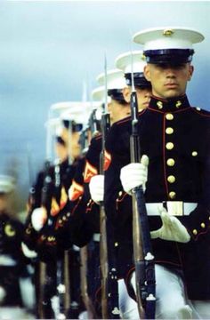 a group of men in uniform standing next to each other