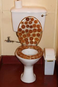 a toilet that has some food on it