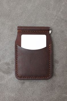 This handmade leather wallet combines elegance and functionality. Its minimalist design is lightweight and elegant enough to carry with you all day long. Made from the finest quality leather, this wallet stands out with its timeless durability and aesthetics. Features: Material: High quality genuine leather Design: Minimalist design does not take up much space and does not bother you when carrying it in your pocket. Money Clip: Comes with a clip that holds your coins securely. Capacity Enough sp Classic Trifold Wallet With Key Clip For Everyday Use, Leather Wallet With Flat Pocket, Everyday Leather Trifold Wallet With Flat Pocket, Leather Card Holder With Coin Pocket For Everyday Use, Minimalist Leather Trifold Wallet With Card Slots, Modern Everyday Wallets With Key Clip, Minimalist Trifold Wallet For Everyday Use, Minimalist Leather Trifold Wallet With Interior Card Slots, Minimalist Leather Card Holder For Business