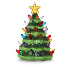 a green ceramic christmas tree with lights on it