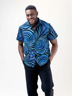 Our Mankon short Sleeve shirt is made of 100% cotton and features a relaxed, fitted silhouette. The African print on this lightweight shirt is subtle but bold, and the colors are beautiful. It's the perfect shirt for any occasion! Description 100% Cotton African Print Wax Short sleeves Front button Top length is 20 inches Made in Cameroon Fabric from Benin Care instructions hand wash cold iron on wrong side hang to dry do not bleach