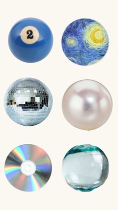 several different types of balls and discs on a white background