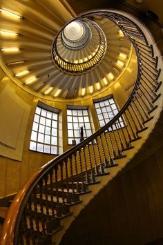 a spiral staircase in a large building