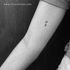 a woman's arm with a small butterfly tattoo on the left inner forearm and wrist