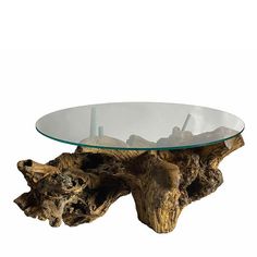 a glass table with driftwood on it