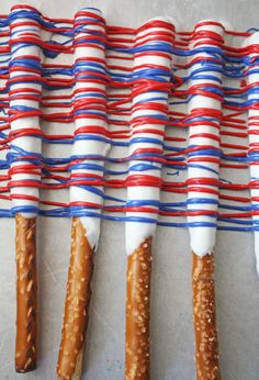 four long pretzels wrapped in red, white and blue paper streamers on top of each other