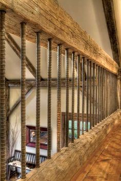 the inside of a house with wood and metal railings