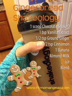 the gingerbread shake is being held up by someone's hand and has cookies on it