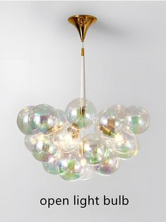 a chandelier with bubbles hanging from it's sides and the words open light bulb below